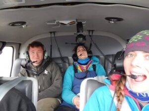 Inside a very small plane with Melissa and two others