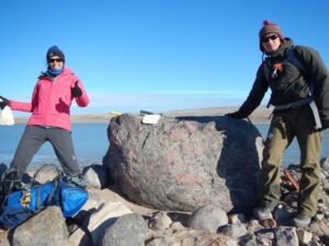 two women at the top of a mountain