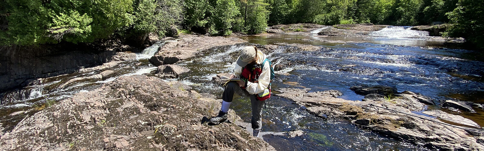 Sally Stevens doing research on a river
